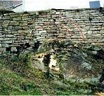 Instandsetzung einer Natursteinmauer.